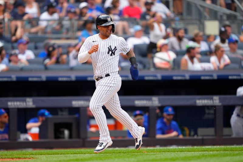 Jul 8, 2023; Bronx, New York, USA; New York Yankees second baseman Gleybor Torres (25) scores a run on New York Yankees center fielder Harrison Bader   s (not pictured) RBI double against the Chicago Cubs during the third inning at Yankee Stadium. Mandatory Credit: Gregory Fisher-USA TODAY Sports