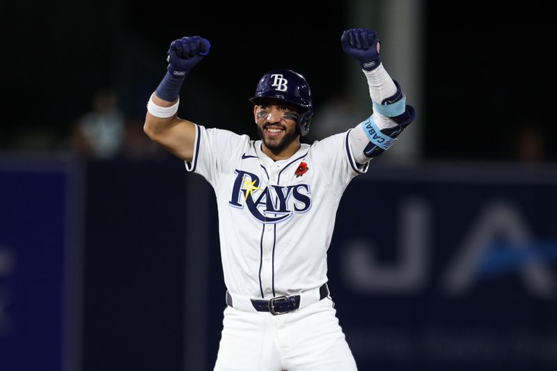 May 26, 2025; Tampa, Florida, USA; Tampa Bay Rays shortstop Jose Caballero (77) hits a two rbi double against the Minnesota Twins in the eighth inning at George M. Steinbrenner Field. Mandatory Credit: Nathan Ray Seebeck-Imagn Images