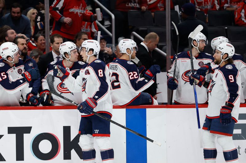 Apr 13, 2025; Washington, District of Columbia, USA; Columbus Blue Jackets defenseman Zach Werenski (8) celebrates with teammates after scoring a goal against the Washington Capitals in the first period at Capital One Arena. Mandatory Credit: Geoff Burke-Imagn Images