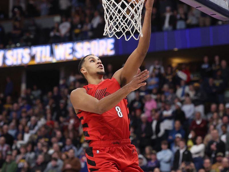 DENVER, COLORADO - FEBRUARY 04: Kris Murray #8 of the Portland Trail Blazers puts in a layup against the Denver Nuggets in the first quarter at Ball Arena on February 04, 2024 in Denver, Colorado.  NOTE TO USER: User expressly acknowledges and agrees that, by downloading and or using this photograph, User is consenting to the terms and conditions of the Getty Images License Agreement.  (Photo by Matthew Stockman/Getty Images)