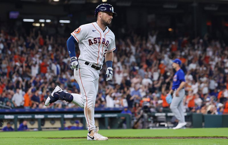 May 17, 2023; Houston, Texas, USA; Chicago Cubs starting pitcher Drew Smyly (11) reacts and Houston Astros third baseman Alex Bregman (2) runs to first base on a home run during the first inning at Minute Maid Park. Mandatory Credit: Troy Taormina-USA TODAY Sports