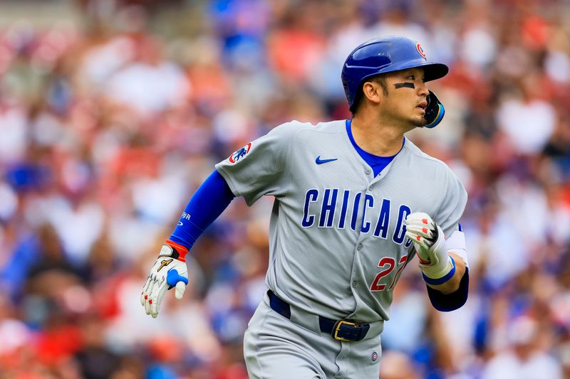 May 25, 2025; Cincinnati, Ohio, USA; Chicago Cubs designated hitter Seiya Suzuki (27) runs to first after hitting a single in the first inning against the Cincinnati Reds at Great American Ball Park. Mandatory Credit: Katie Stratman-Imagn Images