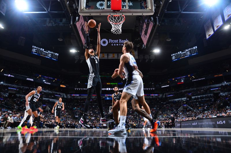 SAN ANTONIO, TX - JANUARY 31: Victor Wembanyama #1 of the San Antonio Spurs grabs a rebound during the game against the Orlando Magic on January 31, 2024 at the Frost Bank Center in San Antonio, Texas. NOTE TO USER: User expressly acknowledges and agrees that, by downloading and or using this photograph, user is consenting to the terms and conditions of the Getty Images License Agreement. Mandatory Copyright Notice: Copyright 2024 NBAE (Photos by Michael Gonzales/NBAE via Getty Images)