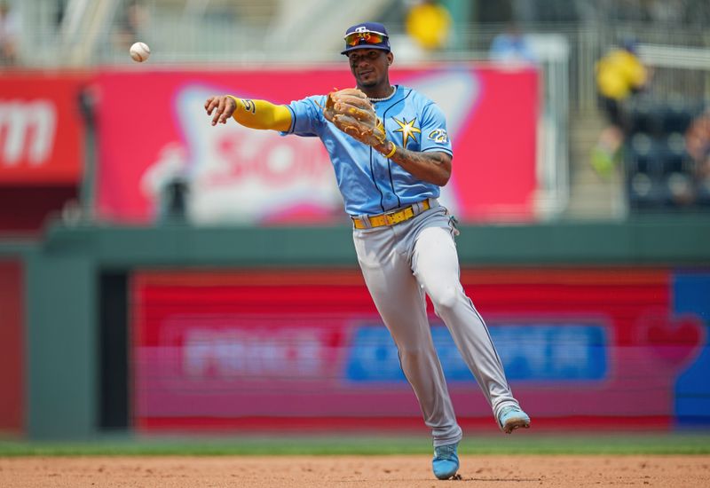 Jul 15, 2023; Kansas City, Missouri, USA; Tampa Bay Rays shortstop Wander Franco (5) throws to first base during the sixth inning at Kauffman Stadium. Mandatory Credit: Jay Biggerstaff-USA TODAY Sports