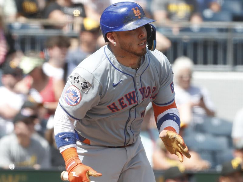 Jul 7, 2024; Pittsburgh, Pennsylvania, USA;  New York Mets catcher Francisco Alvarez (4) hits a double against the Pittsburgh Pirates during the seventh inning at PNC Park. The Mets won 3-2. Mandatory Credit: Charles LeClaire-USA TODAY Sports