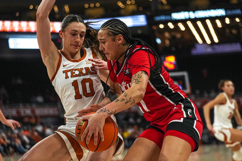 Jan 27, 2024; Austin, TX, USA; the Cincinnati Bearcats guard Ta'Ziah Jenks (11) pushes past Texas Longhorns guard Shay Holle (10) during a game at the Moody Center. Mandatory Credit: Aaron E. Martinez/American-Statesman via USA TODAY NETWORK