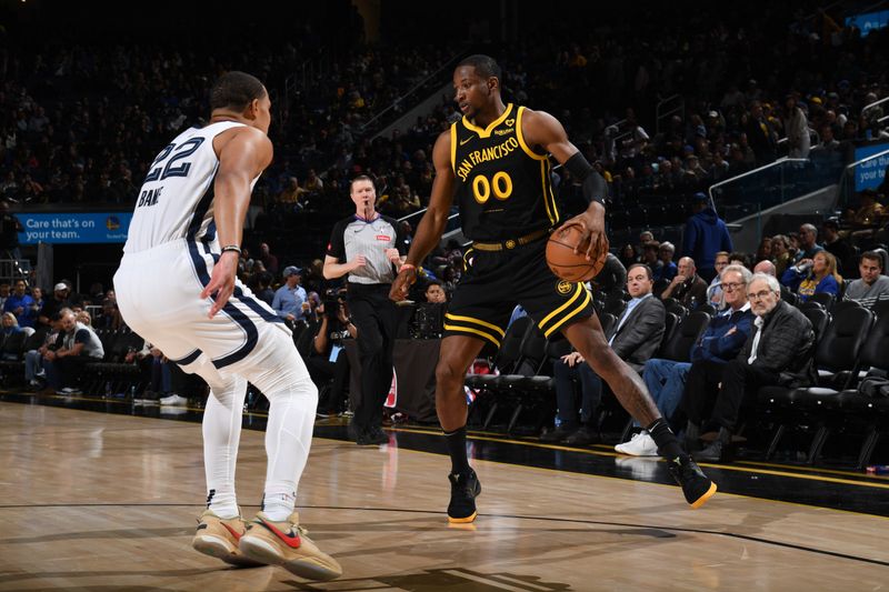 SAN FRANCISCO, CA - MARCH 20: Jonathan Kuminga #00 of the Golden State Warriors dribbles the ball during the game against the Memphis Grizzlies on March 20, 2024 at Chase Center in San Francisco, California. NOTE TO USER: User expressly acknowledges and agrees that, by downloading and or using this photograph, user is consenting to the terms and conditions of Getty Images License Agreement. Mandatory Copyright Notice: Copyright 2024 NBAE (Photo by Noah Graham/NBAE via Getty Images)