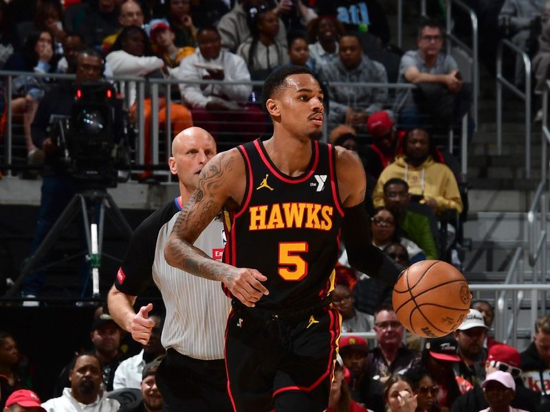 ATLANTA, GA - February 23:  Dejounte Murray #5 of the Atlanta Hawks handles the ball during the game against the Toronto Raptors on February 23, 2024 at State Farm Arena in Atlanta, Georgia.  NOTE TO USER: User expressly acknowledges and agrees that, by downloading and/or using this Photograph, user is consenting to the terms and conditions of the Getty Images License Agreement. Mandatory Copyright Notice: Copyright 2024 NBAE (Photo by Scott Cunningham/NBAE via Getty Images)