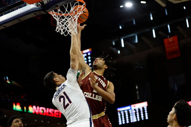 Jan 28, 2023; Charlottesville, Virginia, USA; Boston College Eagles forward T.J. Bickerstaff (1) shoots the ball as Virginia Cavaliers forward Kadin Shedrick (21) defends in the first half at John Paul Jones Arena. Mandatory Credit: Geoff Burke-USA TODAY Sports