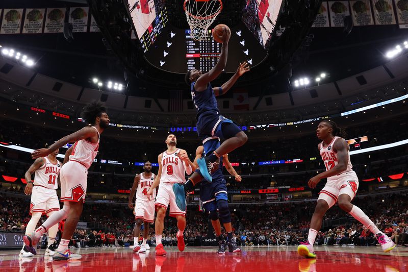 CHICAGO, ILLINOIS - OCTOBER 19: Anthony Edwards #5 of the Minnesota Timberwolves goes up for a layup against the Chicago Bulls during the first half of a preseason game at the United Center on October 19, 2023 in Chicago, Illinois. NOTE TO USER: User expressly acknowledges and agrees that, by downloading and or using this photograph, User is consenting to the terms and conditions of the Getty Images License Agreement.  (Photo by Michael Reaves/Getty Images)