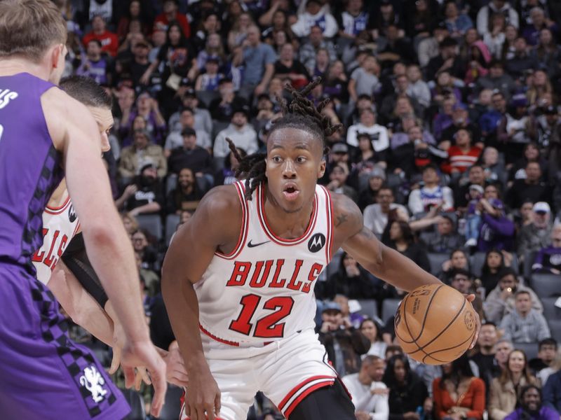 SACRAMENTO, CA - MARCH 4:  Ayo Dosunmu #12 of the Chicago Bulls handles the ball during the game against the Sacramento Kings on March 4, 2024 at Golden 1 Center in Sacramento, California. NOTE TO USER: User expressly acknowledges and agrees that, by downloading and or using this Photograph, user is consenting to the terms and conditions of the Getty Images License Agreement. Mandatory Copyright Notice: Copyright 2024 NBAE (Photo by Rocky Widner/NBAE via Getty Images)