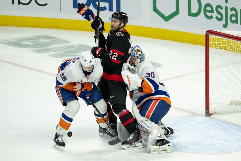 Dec 8, 2024; Ottawa, Ontario, CAN; New York Islanders dewfenseman Alexander Romanov (28) loses a glove as he battles with Ottawa Senators right wing Michael Amadio (22) in the third period at the Canadian Tire Centre. Mandatory Credit: Marc DesRosiers-Imagn Images