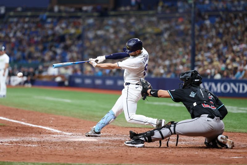 Aug 16, 2024; St. Petersburg, Florida, USA; Tampa Bay Rays designated hitter Brandon Lowe (8) hits a walk off  rbi single against the Arizona Diamondbacks in the ninth inning at Tropicana Field. Mandatory Credit: Nathan Ray Seebeck-USA TODAY Sports