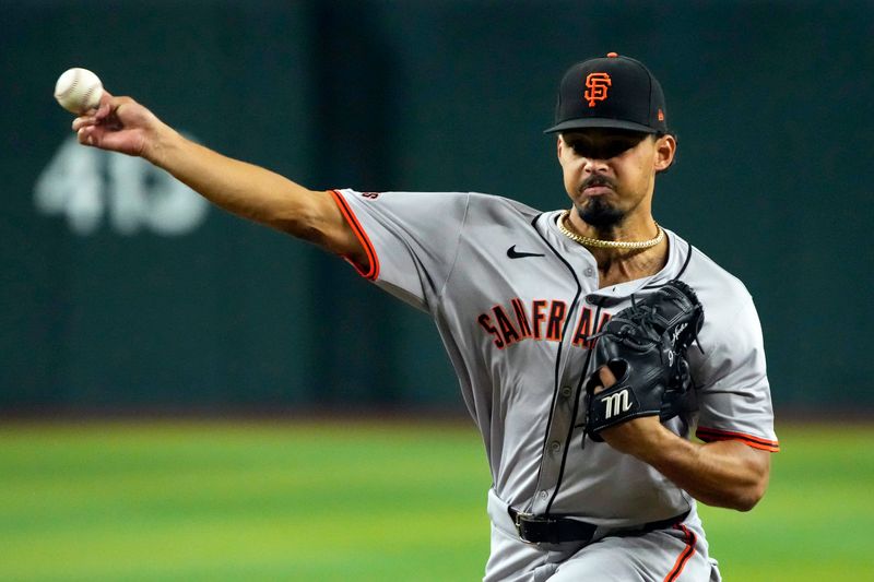 Jun 5, 2024; Phoenix, Arizona, USA; San Francisco Giants pitcher Jordan Hicks (12) throws against the Arizona Diamondbacks in the first inning at Chase Field. Mandatory Credit: Rick Scuteri-USA TODAY Sports