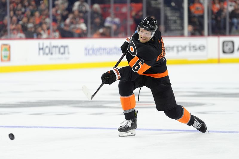 Apr 12, 2025; Philadelphia, Pennsylvania, USA; Philadelphia Flyers defenseman Travis Sanheim (6) shoots the puck against the New York Islanders in the second period at Wells Fargo Center. Mandatory Credit: Kyle Ross-Imagn Images