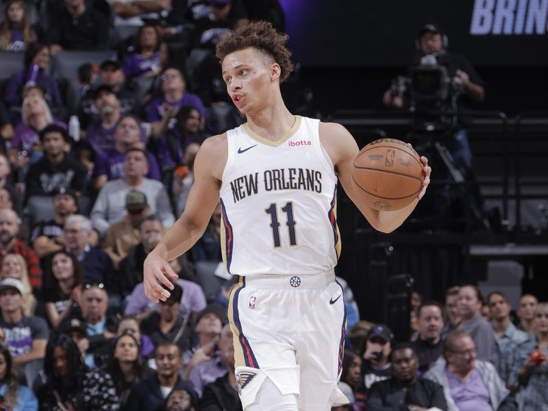 SACRAMENTO, CA - JANUARY 7:  Dyson Daniels #11 of the New Orleans Pelicans handles the ball during the game  on January 7, 2024 at Golden 1 Center in Sacramento, California. NOTE TO USER: User expressly acknowledges and agrees that, by downloading and or using this Photograph, user is consenting to the terms and conditions of the Getty Images License Agreement. Mandatory Copyright Notice: Copyright 2024 NBAE (Photo by Rocky Widner/NBAE via Getty Images)