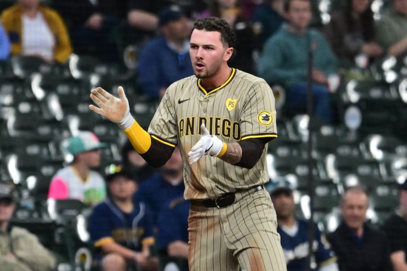 Apr 17, 2024; Milwaukee, Wisconsin, USA;  San Diego Padres center fielder Jackson Merrill (3) reacts after hitting a triple in the seventh inning against the Milwaukee Brewers at American Family Field. Mandatory Credit: Benny Sieu-USA TODAY Sports