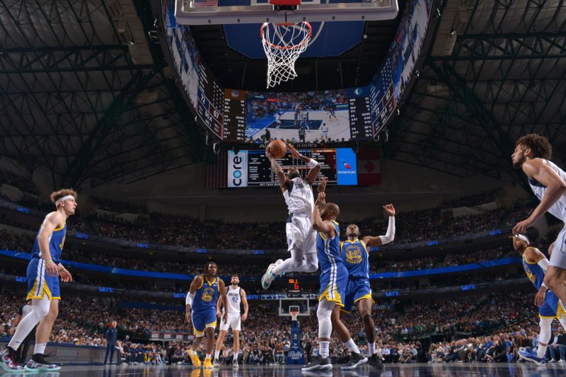 DALLAS, TX - MARCH 13: Kyrie Irving #11 of the Dallas Mavericks drives to the basket during the game against the Golden State Warriors on March 13, 2024 at the American Airlines Center in Dallas, Texas. NOTE TO USER: User expressly acknowledges and agrees that, by downloading and or using this photograph, User is consenting to the terms and conditions of the Getty Images License Agreement. Mandatory Copyright Notice: Copyright 2024 NBAE (Photo by Glenn James/NBAE via Getty Images)