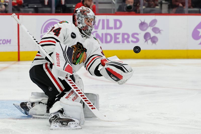 Nov 30, 2023; Detroit, Michigan, USA; Chicago Blackhawks goaltender Petr Mrazek (34) makes a save in the second period against the Detroit Red Wings at Little Caesars Arena. Mandatory Credit: Rick Osentoski-USA TODAY Sports