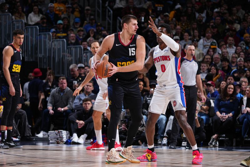 DENVER, CO - JANUARY 7: Nikola Jokic #15 of the Denver Nuggets dribbles the ball during the game against the Detroit Pistons on January 7, 2024 at the Ball Arena in Denver, Colorado. NOTE TO USER: User expressly acknowledges and agrees that, by downloading and/or using this Photograph, user is consenting to the terms and conditions of the Getty Images License Agreement. Mandatory Copyright Notice: Copyright 2024 NBAE (Photo by Garrett Ellwood/NBAE via Getty Images)