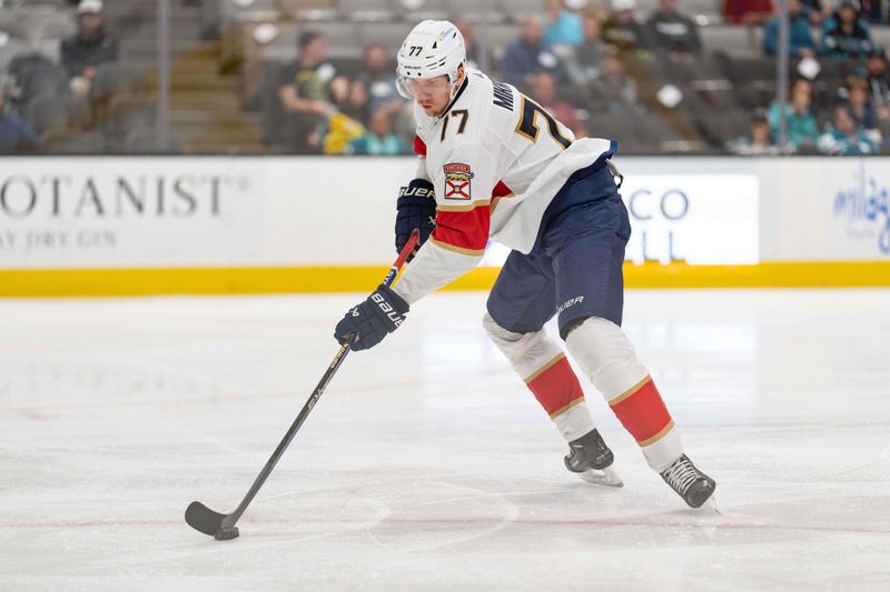 Nov 14, 2023; San Jose, California, USA; Florida Panthers defenseman Dmitry Kulikov (7) controls the puck during the second period against the San Jose Sharks at SAP Center at San Jose. Mandatory Credit: Stan Szeto-USA TODAY Sports