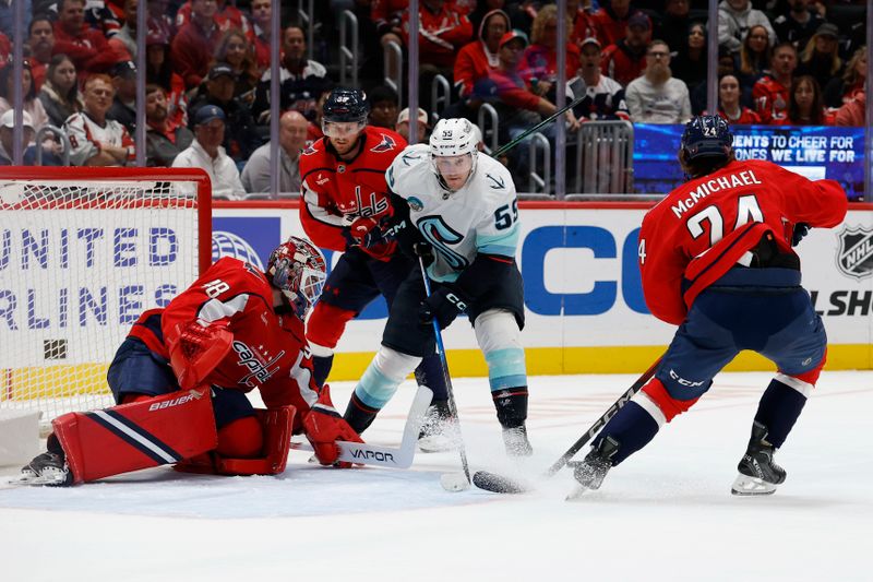 Oct 21, 2025; Washington, District of Columbia, USA; Washington Capitals goaltender Logan Thompson (48) makes a save against on Seattle Kraken forward Ben Meyers (59) as Capitals defenseman Rasmus Sandin (38) defends during the second period at Capital One Arena. Mandatory Credit: Geoff Burke-Imagn Images