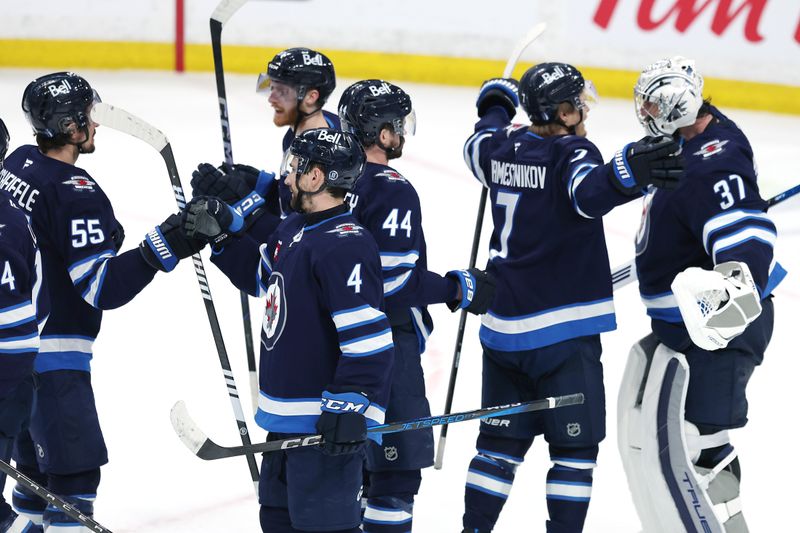 May 9, 2025; Winnipeg, Manitoba, CAN; Winnipeg Jets celebrate their victory over the Dallas Stars in game two of the second round of the 2025 Stanley Cup Playoffs at Canada Life Centre. Mandatory Credit: James Carey Lauder-Imagn Images