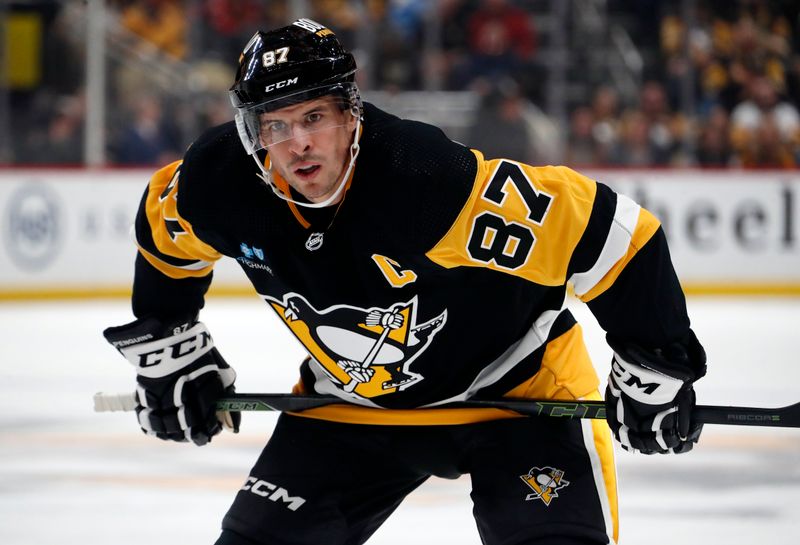 Oct 10, 2023; Pittsburgh, Pennsylvania, USA; Pittsburgh Penguins center Sidney Crosby (87) prepares to take a face-off against the Chicago Blackhawks during the first period at the PPG Paints Arena. Mandatory Credit: Charles LeClaire-USA TODAY Sports