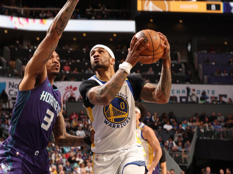 CHARLOTTE, NC - MARCH 3: Gary Payton II #0 of the Golden State Warriors drives to the basket during the game against the Charlotte Hornets on March 3, 2025 at Spectrum Center in Charlotte, North Carolina. NOTE TO USER: User expressly acknowledges and agrees that, by downloading and or using this photograph, User is consenting to the terms and conditions of the Getty Images License Agreement. Mandatory Copyright Notice: Copyright 2025 NBAE (Photo by Kent Smith/NBAE via Getty Images)