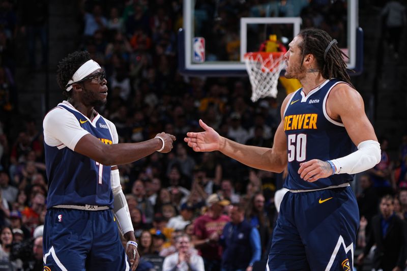 DENVER, CO - MARCH 31: Reggie Jackson #7 of the Denver Nuggets high fives Aaron Gordon #50 during the game against the Cleveland Cavaliers on March 31, 2024 at the Ball Arena in Denver, Colorado. NOTE TO USER: User expressly acknowledges and agrees that, by downloading and/or using this Photograph, user is consenting to the terms and conditions of the Getty Images License Agreement. Mandatory Copyright Notice: Copyright 2024 NBAE (Photo by Garrett Ellwood/NBAE via Getty Images)