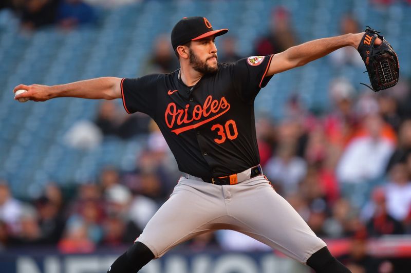 Apr 23, 2024; Anaheim, California, USA; Baltimore Orioles pitcher Grayson Rodriguez (30) throws against the Los Angeles Angels during the first inning at Angel Stadium. Mandatory Credit: Gary A. Vasquez-USA TODAY Sports