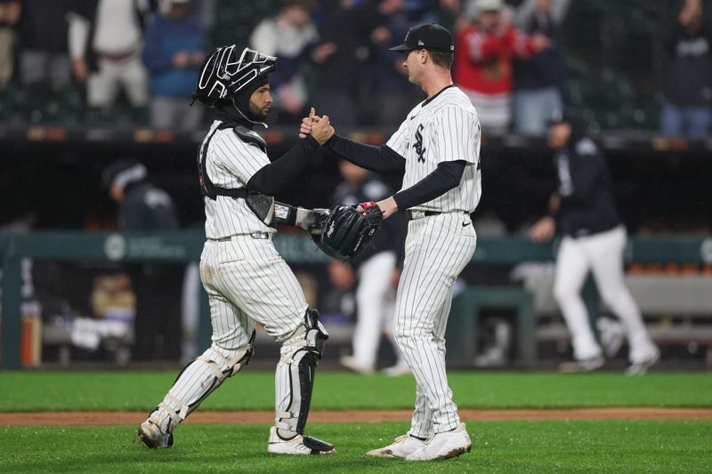 May 20, 2025; Chicago, Illinois, USA; Chicago White Sox relief pitcher Jordan Leasure (49) celebrates with catcher Edgar Quero (7) team's win against the Seattle Mariners at Rate Field. Mandatory Credit: Kamil Krzaczynski-Imagn Images