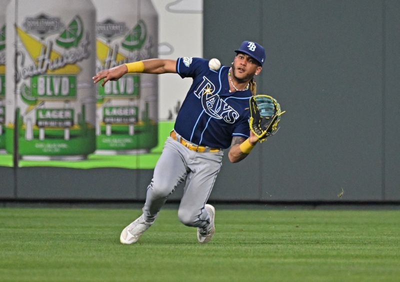 Jul 15, 2023; Kansas City, Missouri, USA;  Tampa Bay Rays center fielder Jose Siri (22) makes a sliding catch against the Kansas City Royals for the final out of the game at Kauffman Stadium. Mandatory Credit: Peter Aiken-USA TODAY Sports