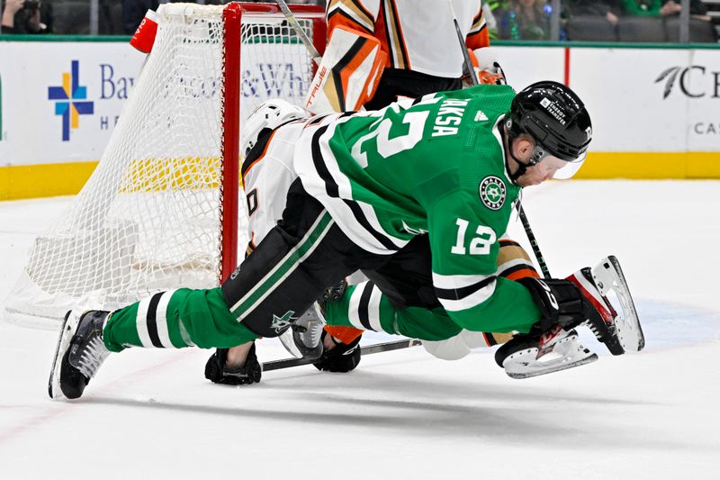 Jan 25, 2024; Dallas, Texas, USA; Dallas Stars center Radek Faksa (12) collies with Anaheim Ducks right wing Brett Leason (20) during the second period at the American Airlines Center. Mandatory Credit: Jerome Miron-USA TODAY Sports