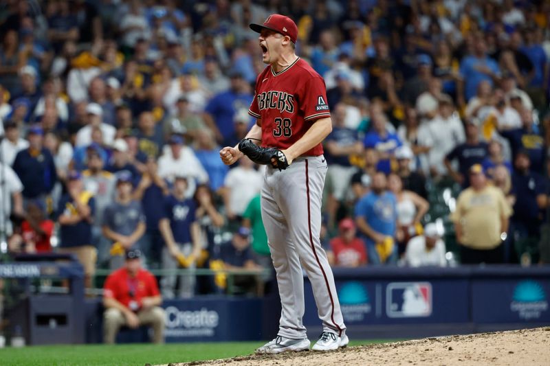 Oct 4, 2023; Milwaukee, Wisconsin, USA; Arizona Diamondbacks relief pitcher Paul Sewald (38) reacts after winning against the Milwaukee Brewers in the ninth inning during game two of the Wildcard series for the 2023 MLB playoffs at American Family Field. Mandatory Credit: Kamil Krzaczynski-USA TODAY Sports