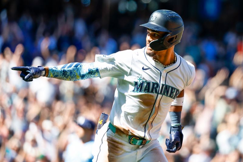 Aug 28, 2024; Seattle, Washington, USA; Seattle Mariners center fielder Julio Rodriguez (44) points back to the dugout after hitting a two-run home run against the Tampa Bay Rays during the fifth inning at T-Mobile Park. Mandatory Credit: Joe Nicholson-USA TODAY Sports