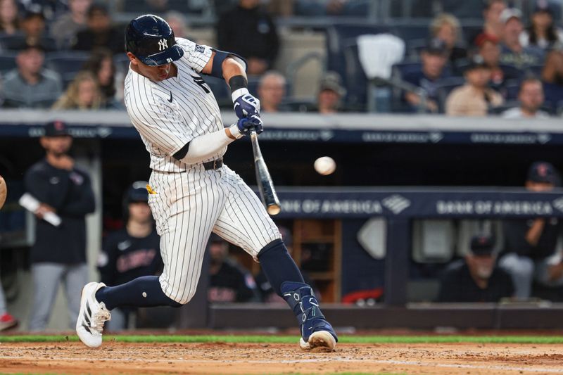 Aug 20, 2024; Bronx, New York, USA; New York Yankees third baseman Oswald Peraza (91) singles during the second inning against the Cleveland Guardians at Yankee Stadium. Mandatory Credit: Vincent Carchietta-USA TODAY Sports