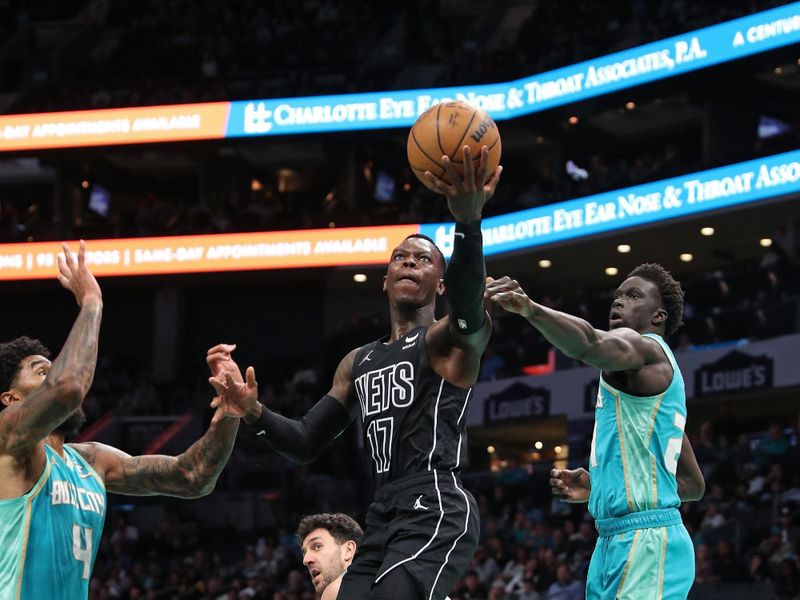 CHARLOTTE, NC - MARCH 9: Dennis Schroder #17 of the Brooklyn Nets drives to the basket during the game against the Charlotte Hornets on March 9, 2024 at the Spectrum Center in Charlotte, North Carolina. NOTE TO USER: User expressly acknowledges and agrees that, by downloading and or using this photograph, User is consenting to the terms and conditions of the Getty Images License Agreement.  Mandatory Copyright Notice:  Copyright 2024 NBAE (Photo by Brock Williams-Smith/NBAE via Getty Images)