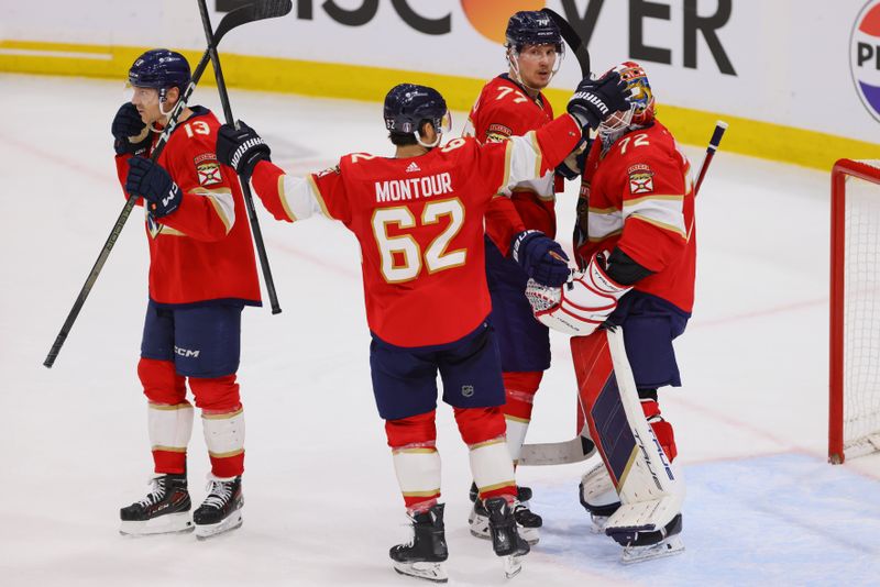 Apr 21, 2024; Sunrise, Florida, USA;Florida Panthers defenseman Brandon Montour (62) celebrates with goaltender Sergei Bobrovsky (72) and defenseman Niko Mikkola (77) after defeating the Tampa Bay Lightning in game one of the first round of the 2024 Stanley Cup Playoffs at Amerant Bank Arena. Mandatory Credit: Sam Navarro-USA TODAY Sports