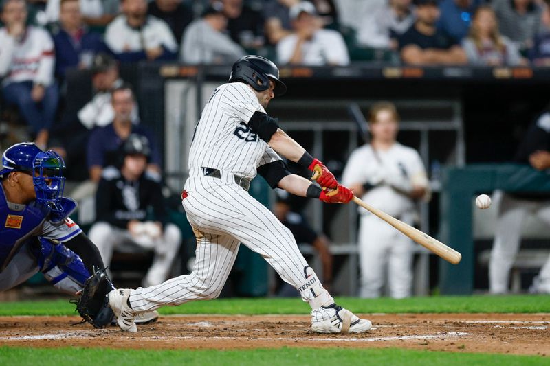 Aug 27, 2025; Chicago, Illinois, USA; Chicago White Sox left fielder Andrew Benintendi (23) hits a solo home run against the Kansas City Royals during the fourth inning at Rate Field. Mandatory Credit: Kamil Krzaczynski-Imagn Images Aug 27, 2025; Chicago, Illinois, USA; Chicago White Sox left fielder Andrew Benintendi (23) hits a solo home run against the Kansas City Royals during the fourth inning at Rate Field. Mandatory Credit: Kamil Krzaczynski-Imagn Images