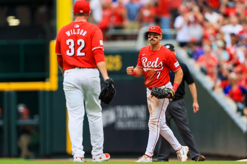 Jun 8, 2024; Cincinnati, Ohio, USA; Cincinnati Reds first baseman Spencer Steer (7) reacts with relief pitcher Justin Wilson (32) after the victory over the Chicago Cubs at Great American Ball Park. Mandatory Credit: Katie Stratman-USA TODAY Sports