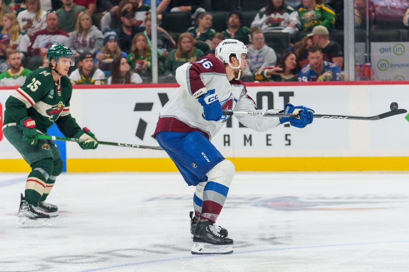 Sep 28, 2023; Saint Paul, Minnesota, USA; Colorado Avalanche defenseman Kurtis MacDermid (56) snags the puck pressed by Minnesota Wild defenseman Jonas Brodin (25) in the third period at Xcel Energy Center. Mandatory Credit: Matt Blewett-USA TODAY Sports