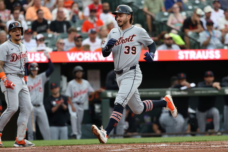 Jun 10, 2025; Baltimore, Maryland, USA; Detroit Tigers outfielder Zach McKinstry (39) scores during the second inning against the Baltimore Orioles at Oriole Park at Camden Yards. Mandatory Credit: Daniel Kucin Jr.-Imagn Images