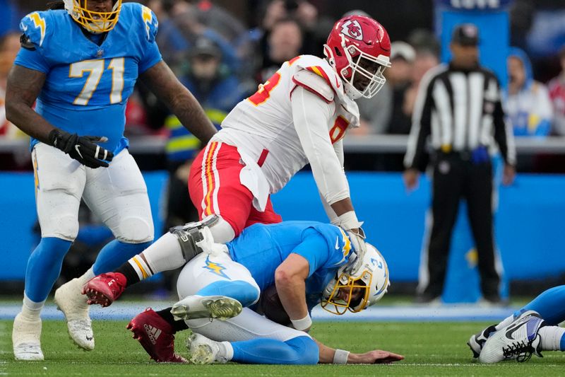 Kansas City Chiefs defensive tackle Chris Jones sacks Los Angeles Chargers quarterback Easton Stick during the second half of an NFL football game, Sunday, Jan. 7, 2024, in Inglewood, Calif. The sack earned Jones a $1.25 million contract incentive. (AP Photo/Ashley Landis)