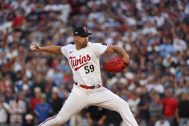 Oct 4, 2023; Minneapolis, Minnesota, USA; Minnesota Twins relief pitcher Jhoan Duran (59) delivers a pitch in the ninth inning against the Toronto Blue Jays during game two of the Wildcard series for the 2023 MLB playoffs at Target Field. Mandatory Credit: Jesse Johnson-USA TODAY Sports