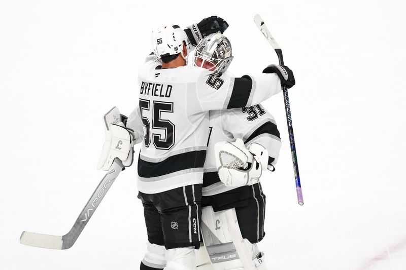 Oct 8, 2025; Las Vegas, Nevada, USA; Los Angeles Kings right wing Quinton Byfield (55) celebrates with Los Angeles Kings goaltender Anton Forsberg (31) after the Kings defeated the Vegas Golden Knights 6-5 in a shoot-out at T-Mobile Arena. Mandatory Credit: Stephen R. Sylvanie-Imagn Images