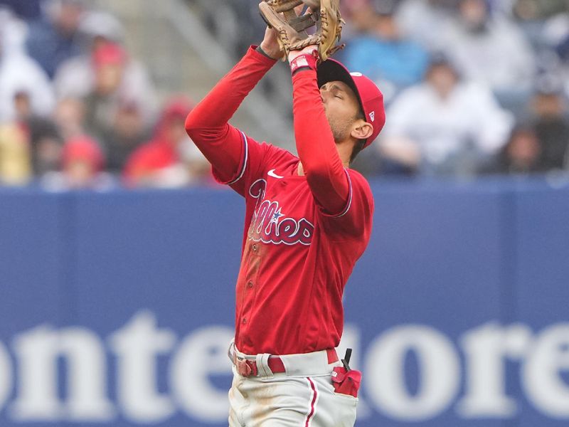 Apr 5, 2023; Bronx, New York, USA; Philadelphia Phillies shortstop Trea Turner (7) catches a fly ball hit by New York Yankees first baseman Anthony Rizzo (48) (not pictured) during the sixth inning at Yankee Stadium. Mandatory Credit: Gregory Fisher-USA TODAY Sports