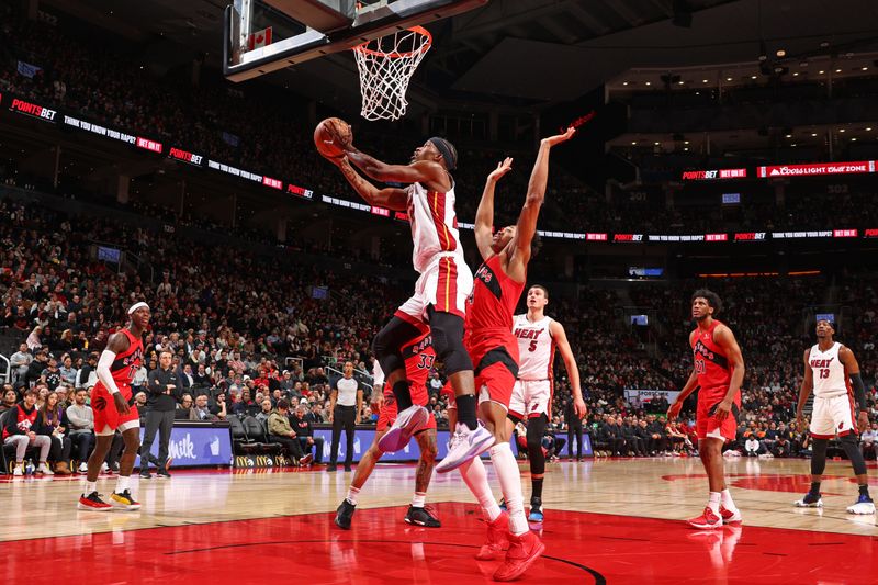 TORONTO, CANADA - JANUARY 17: Jimmy Butler #22 of the Miami Heat drives to the basket during the game against the Toronto Raptors on January 17, 2024 at the Scotiabank Arena in Toronto, Ontario, Canada.  NOTE TO USER: User expressly acknowledges and agrees that, by downloading and or using this Photograph, user is consenting to the terms and conditions of the Getty Images License Agreement.  Mandatory Copyright Notice: Copyright 2024 NBAE (Photo by Vaughn Ridley/NBAE via Getty Images)