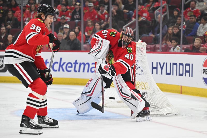 Apr 12, 2024; Chicago, Illinois, USA; Chicago Blackhawks goaltender Arvid Soderblom (40) passes the puck up the ice in the first period against the Nashville Predators at United Center. Mandatory Credit: Jamie Sabau-USA TODAY Sports