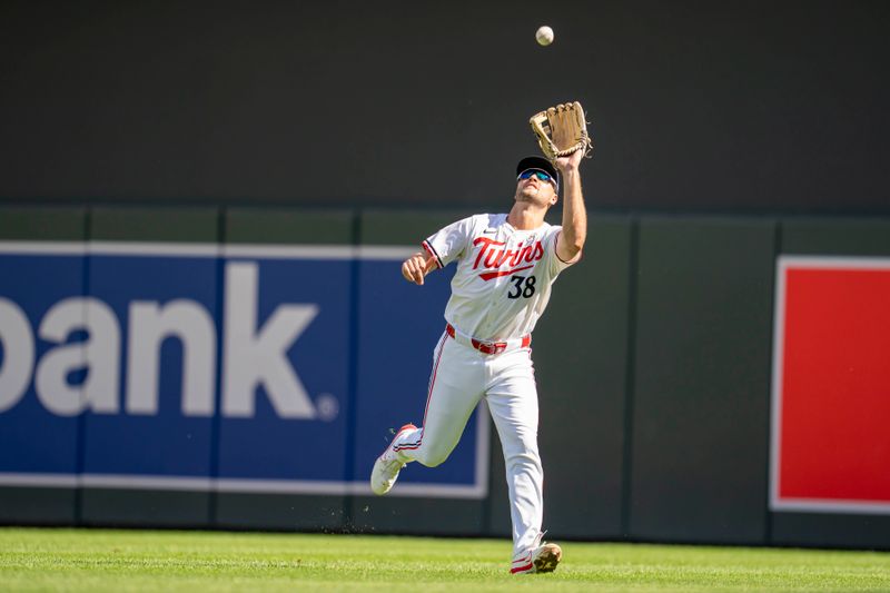 Sep 15, 2024; Minneapolis, Minnesota, USA; Minnesota Twins right fielder Matt Wallner (38) catches a fly ball against the Cincinnati Reds in the eighth inning at Target Field. Mandatory Credit: Jesse Johnson-Imagn Images